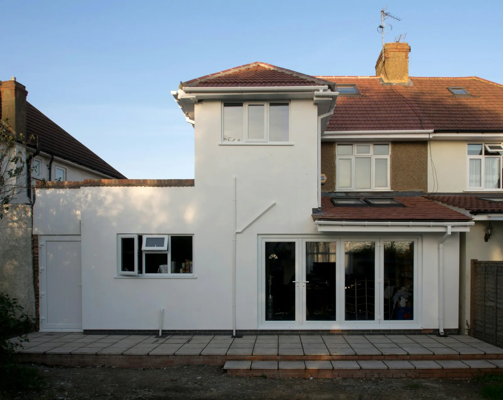 A finished single-storey extension with large windows.