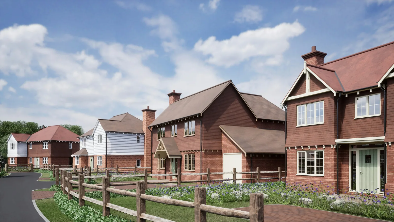 A row of new red brick houses beside a road.