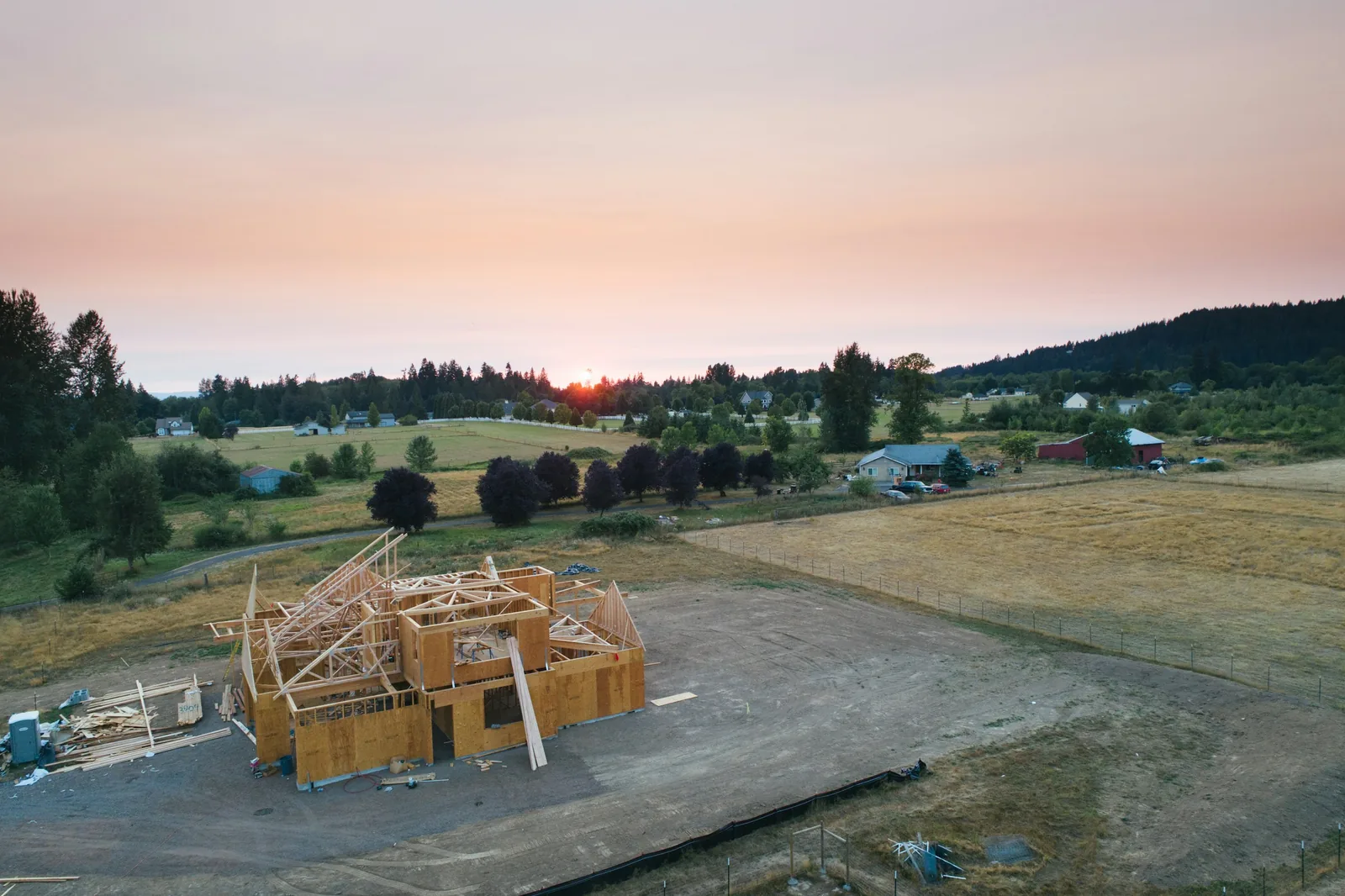 A timber-framed building under construction.