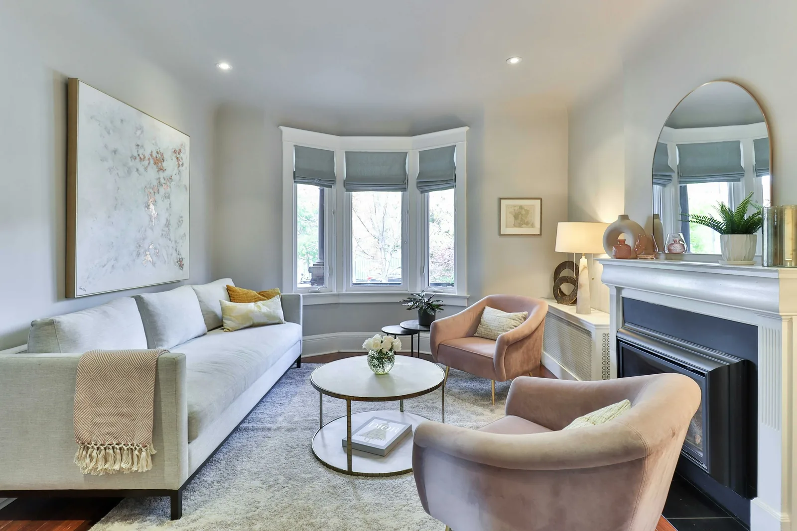 A living room with a fireplace and fitted joinery.