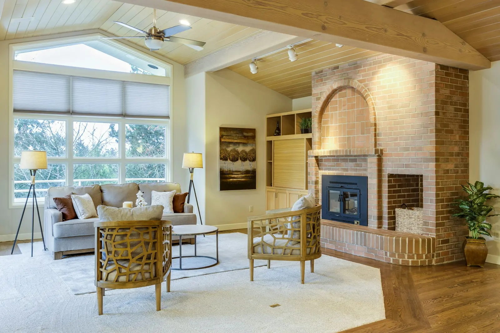 A simply furnished room in brown and grey.