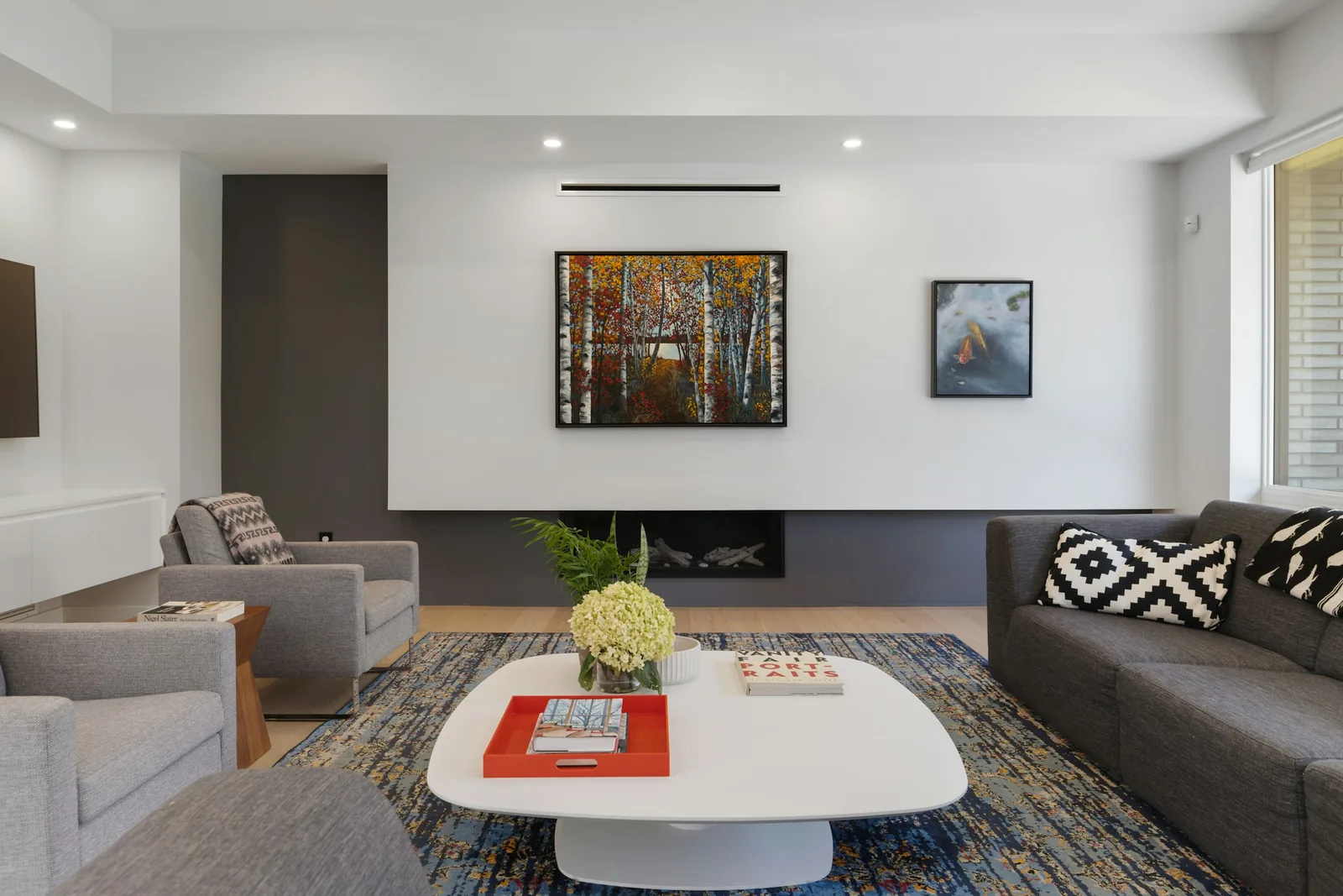 A living room with a sofa and a coffee table.